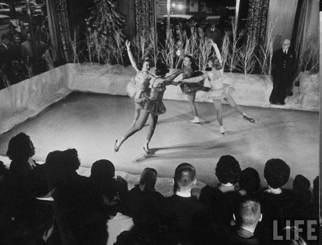 April 1960. Ice skating show, held in Manhattan Savings Bank's lobby for Christmas benefit of customers.